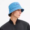 Buckethat i denim med broderad Coach-logotyp