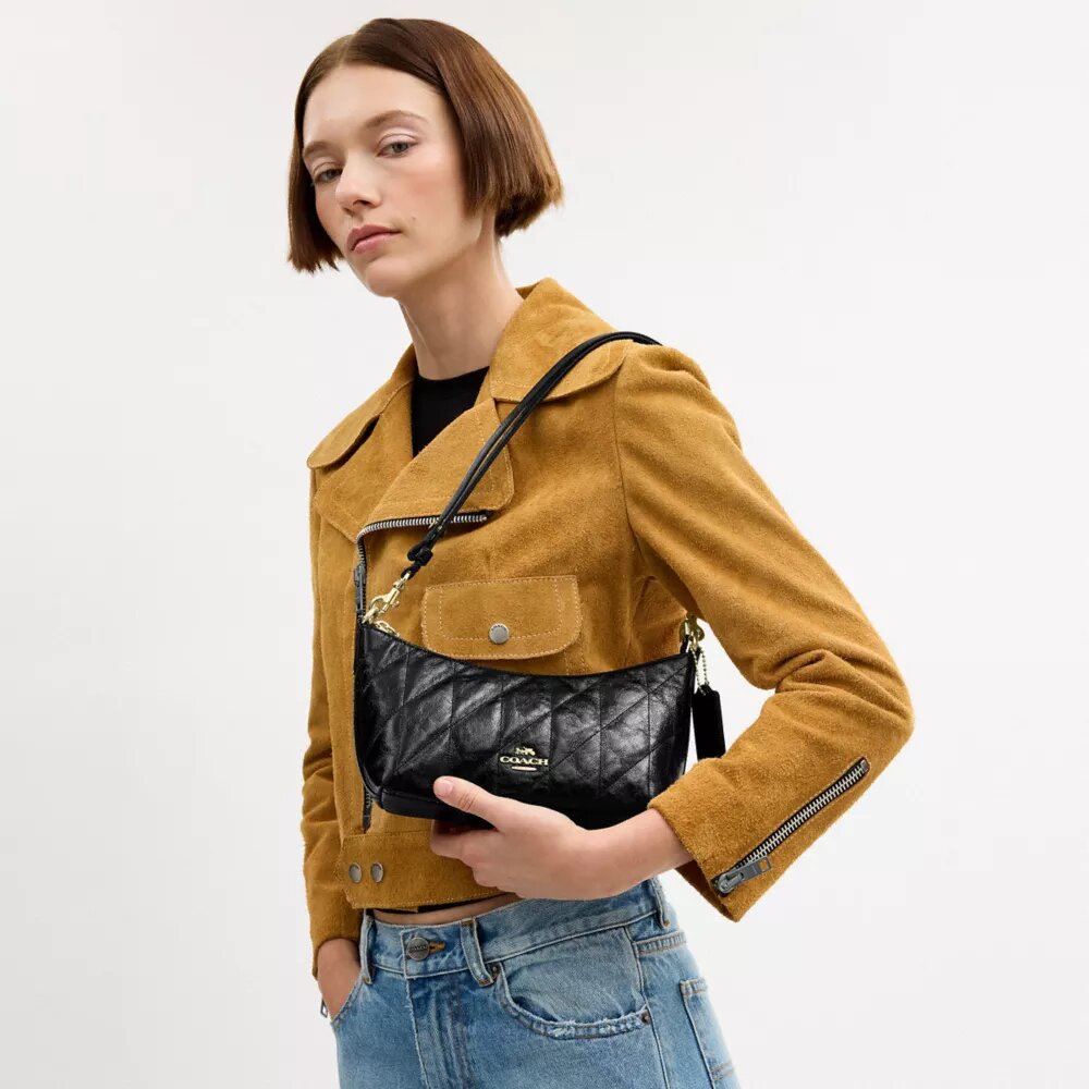 Caitlin-axelremsväskor med quiltning