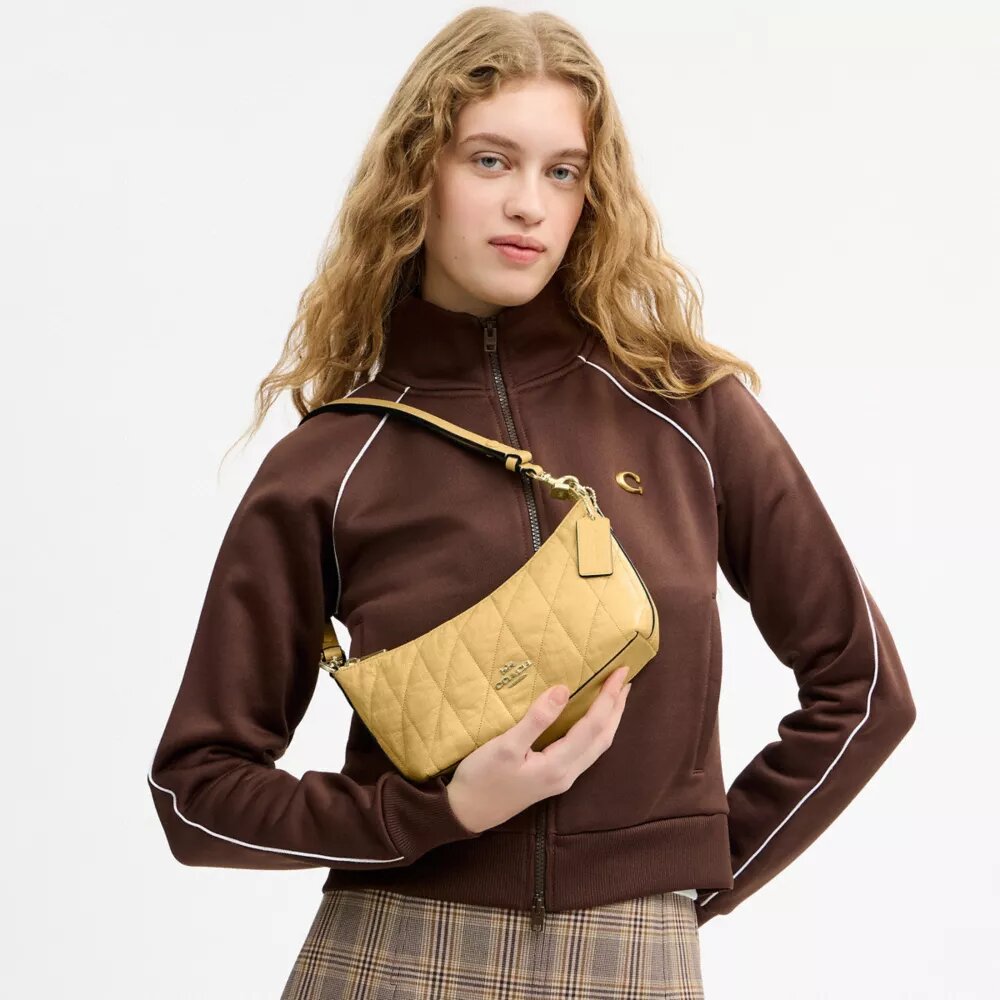 Caitlin-axelremsväskor med quiltning