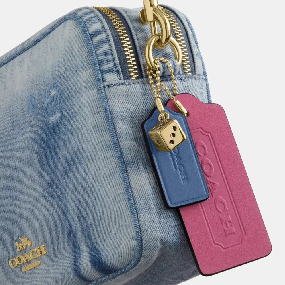 Carey-axelremsväska i Loved Denim med smycken