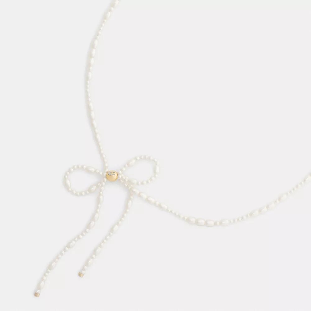 Chokerhalsband med pärlrosett