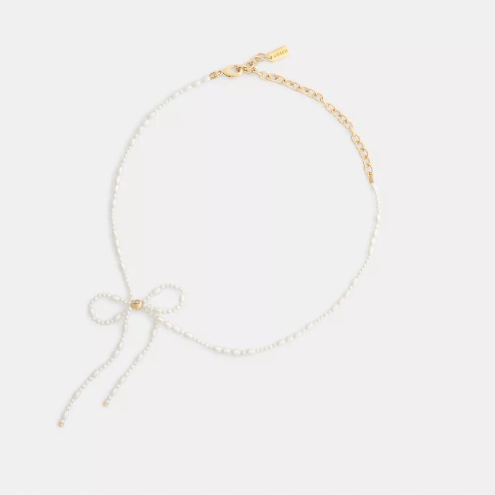 Chokerhalsband med pärlrosett