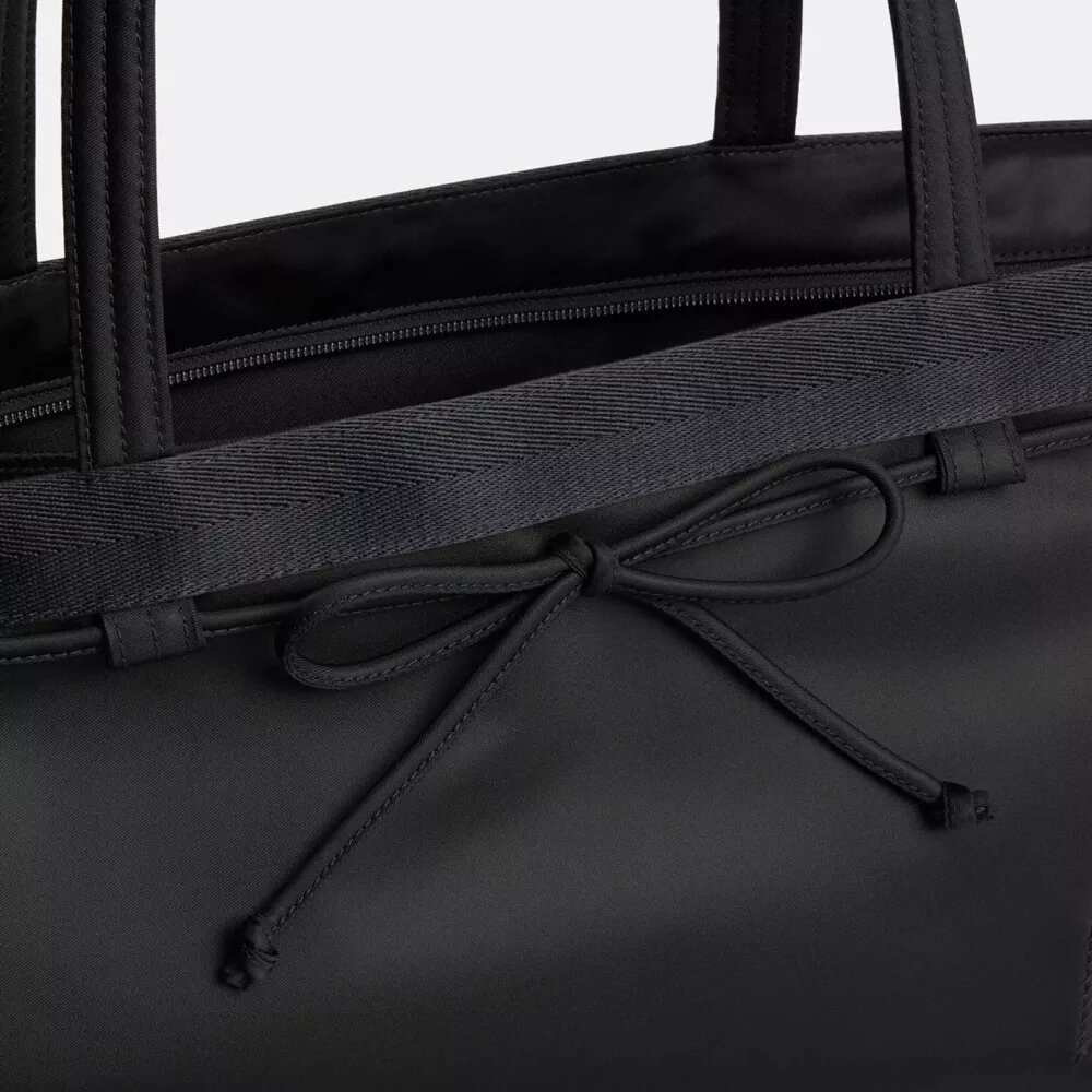 Coachtopia Loop Bow-tygkassar