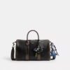 Compass Bag 35 i slitet läder med smycken