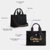 Disney X Coach Cargo Tygkassa 26 med Musse Pigg i regenerativ bomullscanvas