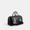 Disney X Coach Compass Bag 35 med Pluto