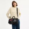 Disney X Coach Compass Bag 35 med Pluto