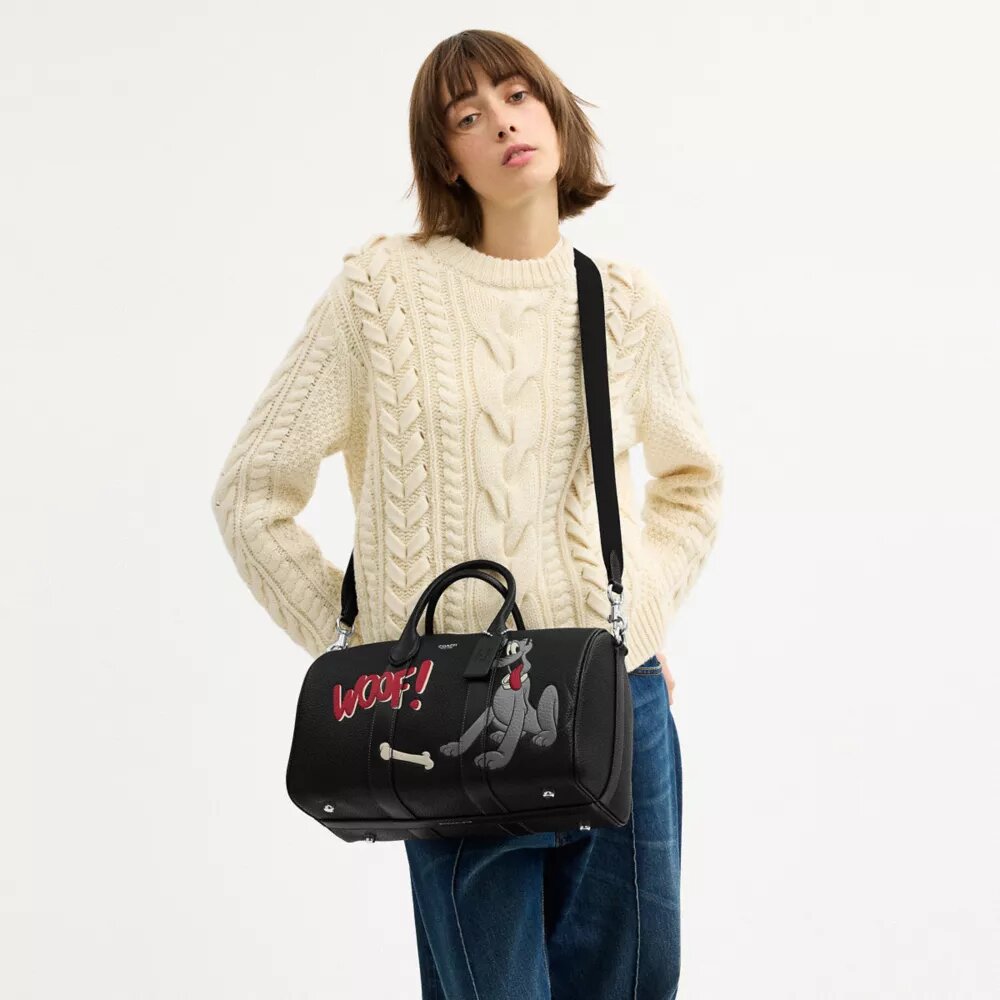Disney X Coach Compass Bag 35 med Pluto
