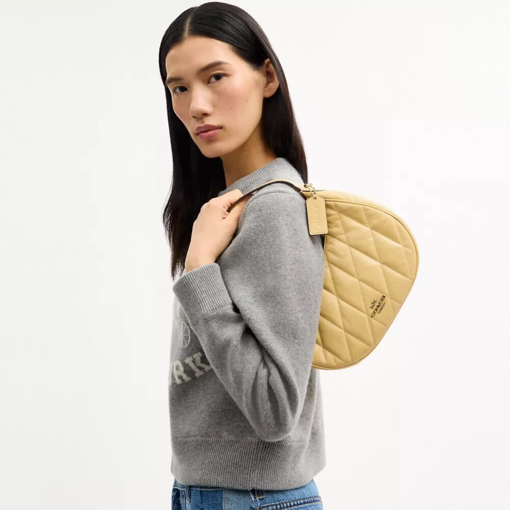 Emily axelremsväskor med quiltning