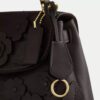 Emory-väska med handtag och blommig applikation