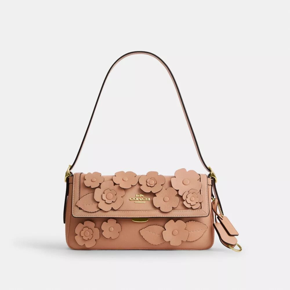 Etta liten axelremsväskor med lock och blommig applikation