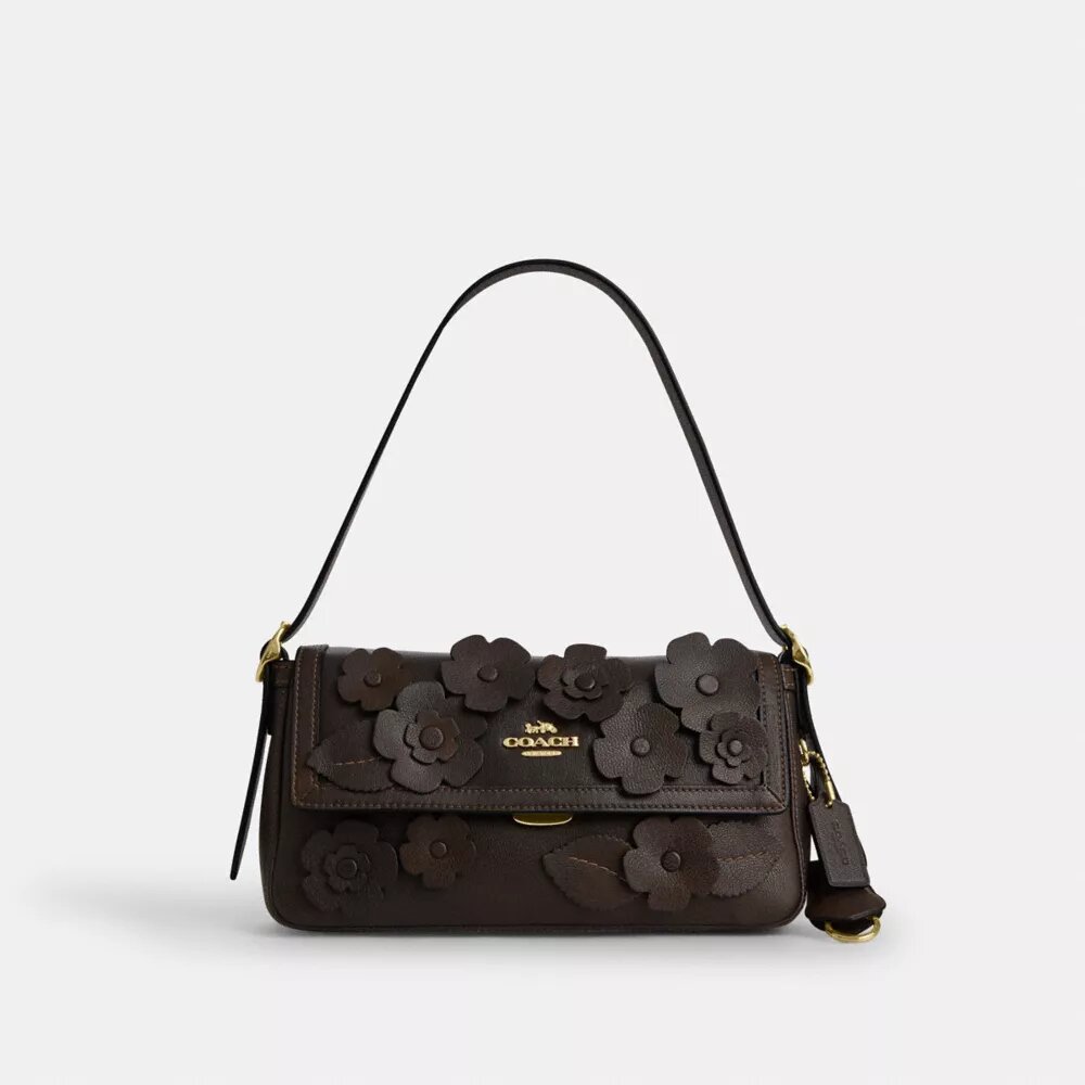 Etta liten axelremsväskor med lock och blommig applikation