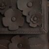 Etta liten axelremsväskor med lock och blommig applikation