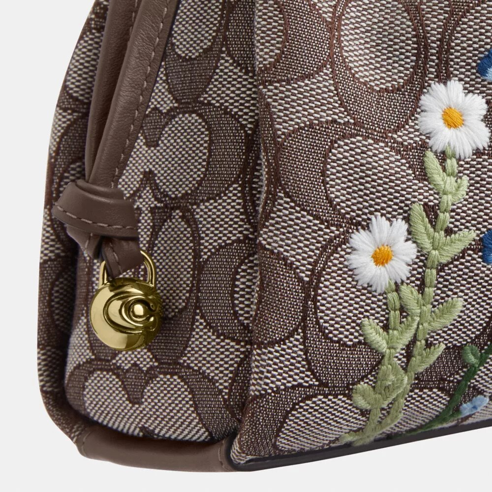 Faye-axelremsväskor i signaturjacquard med blommig broderi