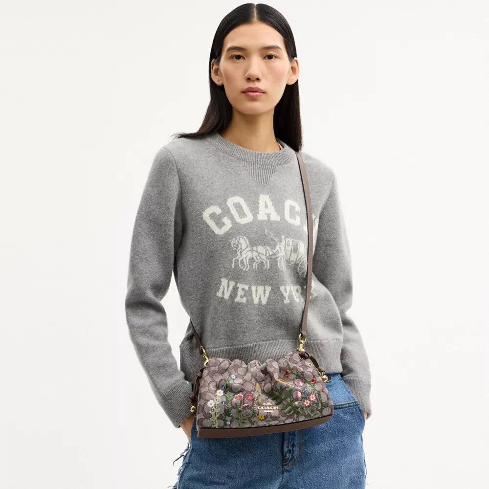 Faye-axelremsväskor i signaturjacquard med blommig broderi