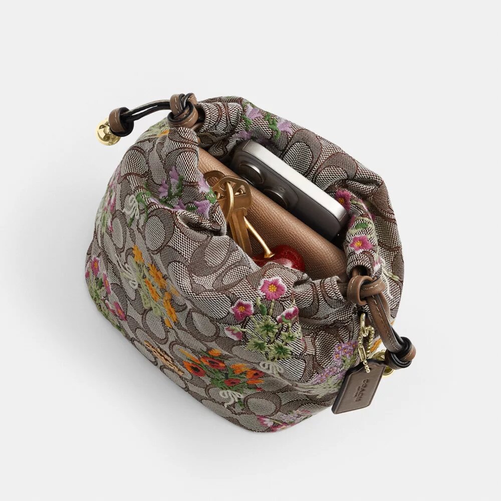 Faye Mini-dragpåse i signaturjacquard med blommig broderi