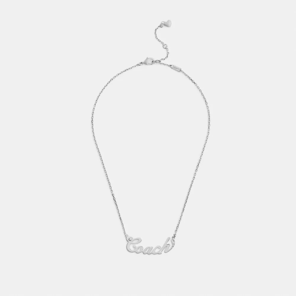Halsband med namnskylt i Coach Script