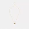 Halsband med upprepade C-formade rondeller