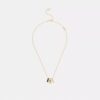 Halsband med upprepade C-formade rondeller