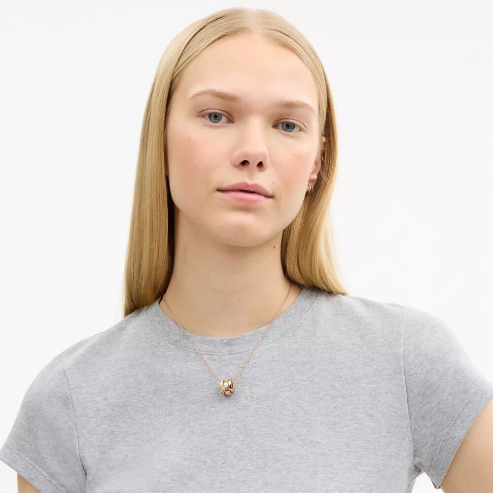 Halsband med upprepade C-formade rondeller