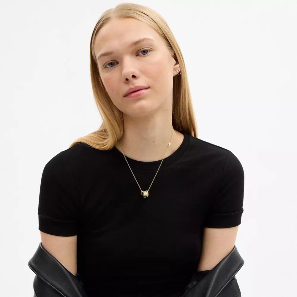 Halsband med upprepade C-formade rondeller