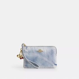Handlovsväskor med dragkedja i hörnen i sliten denim med smycken