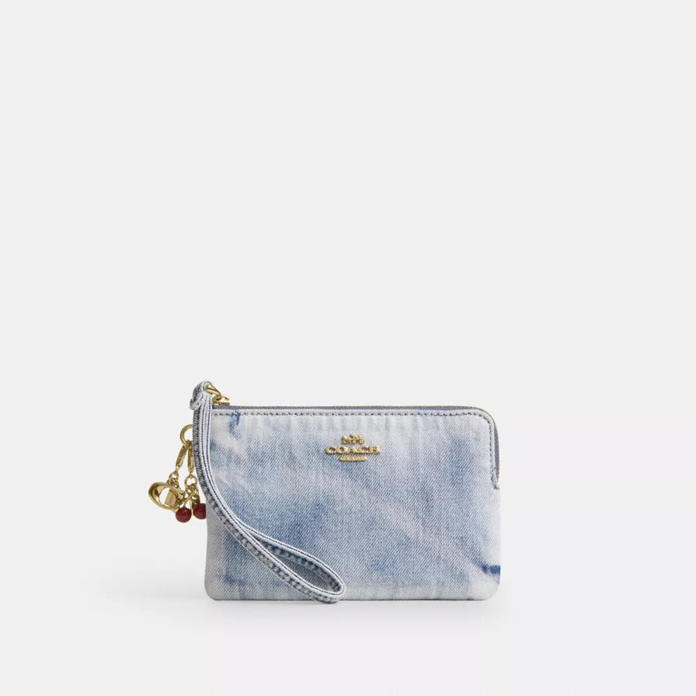 Handlovsväskor med dragkedja i hörnen i sliten denim med smycken