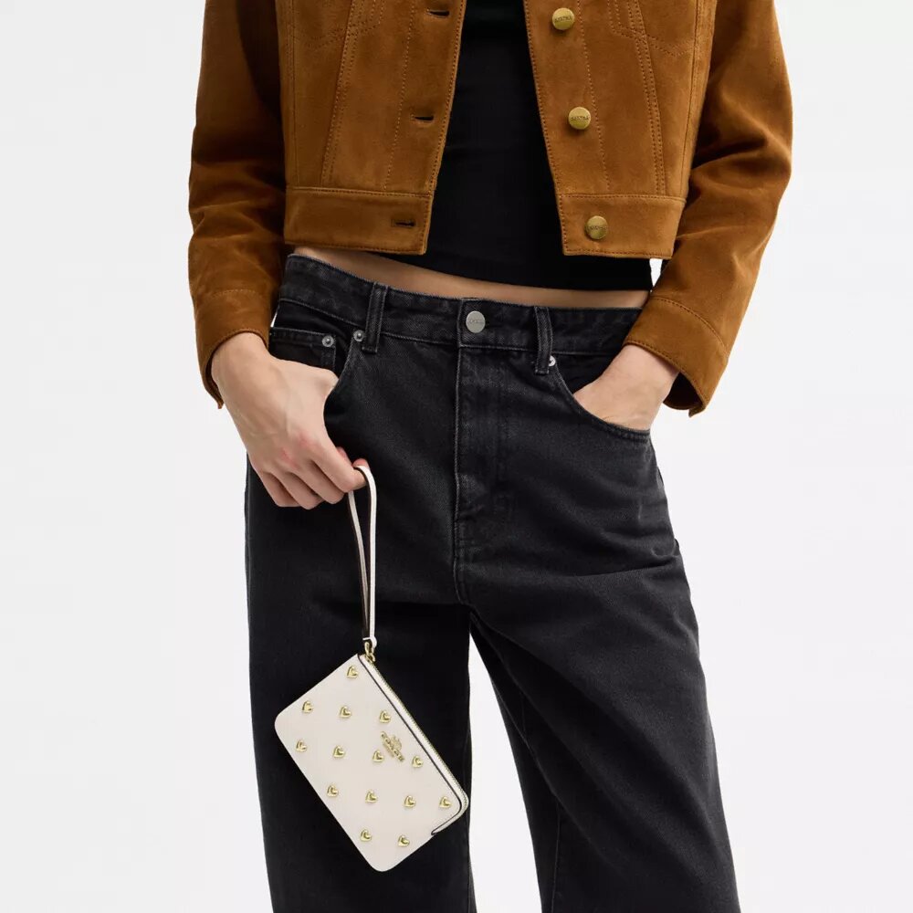 Handlovsväskor med dragkedja i hörnet och hjärtformade nitar