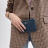 Handlovsväskor med hörnficka och dragkedja i Signature-jacquard