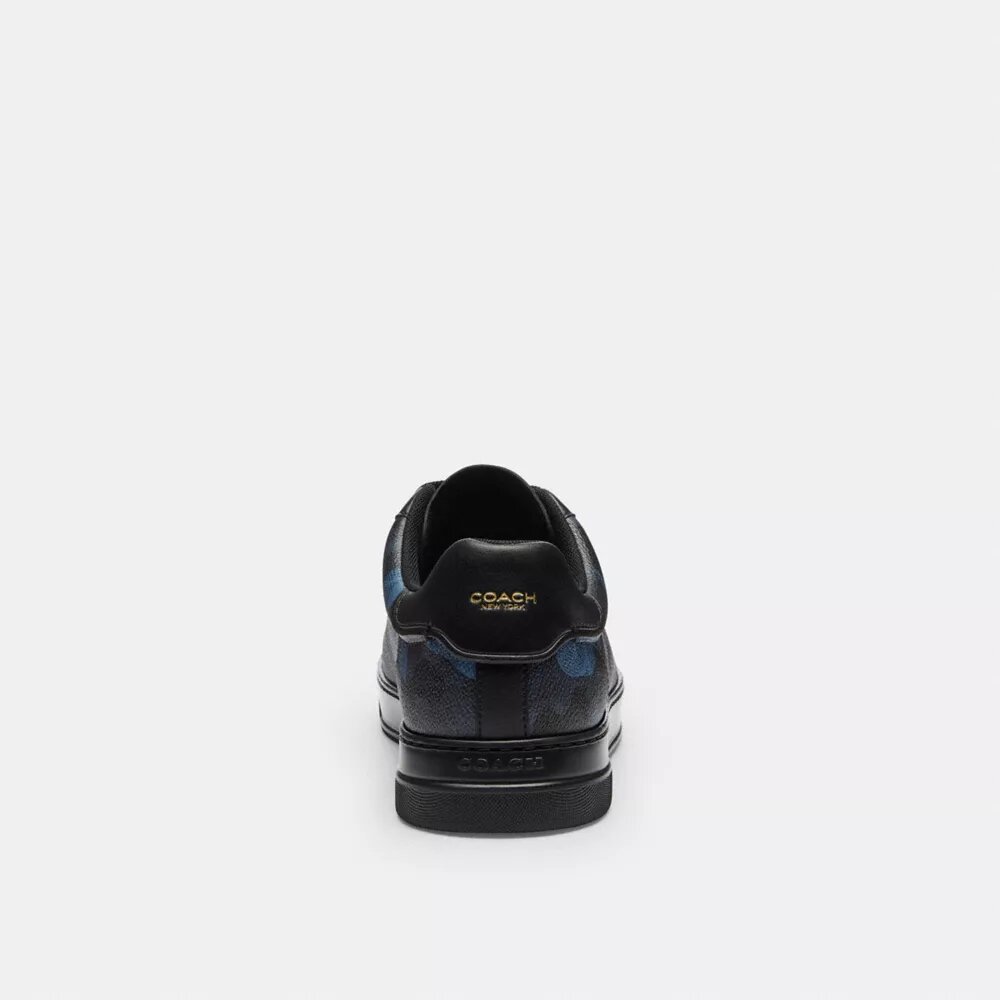 Höga sneakers i vårt Signature Canvas med kamouflage-tryck