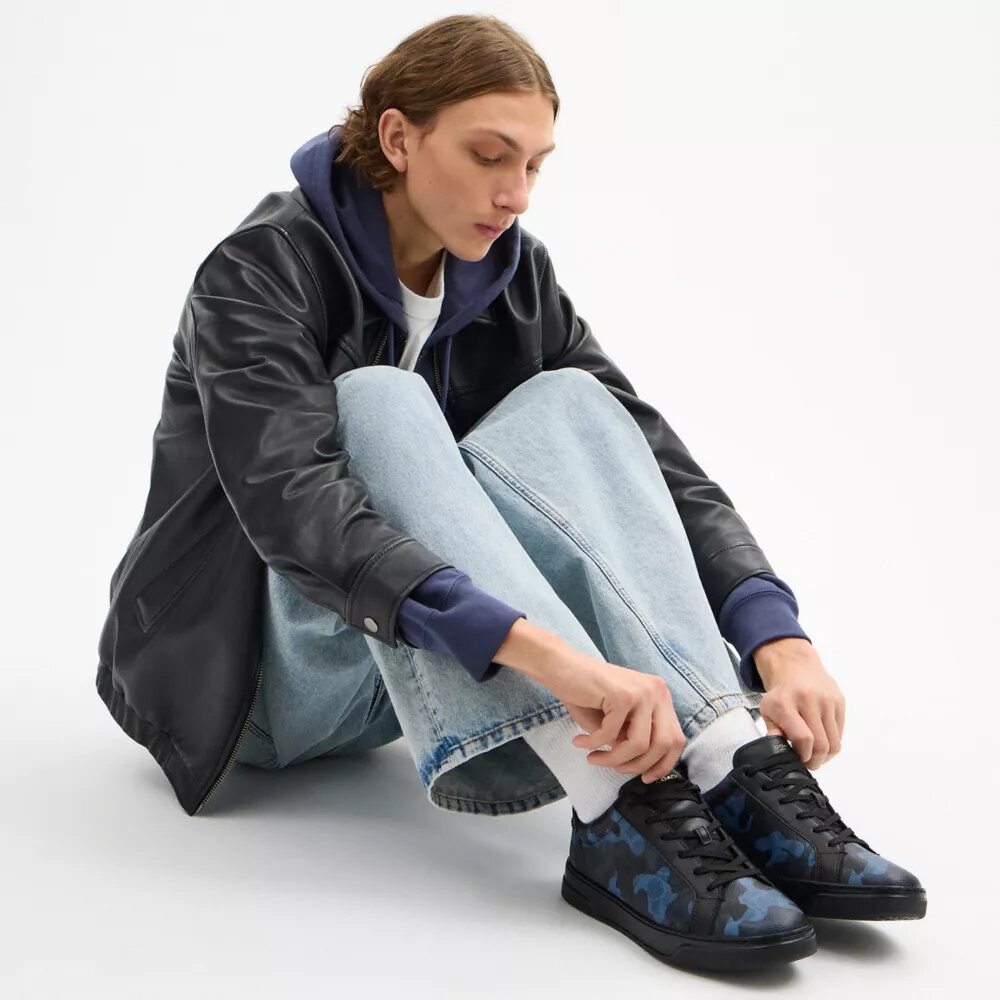 Höga sneakers i vårt Signature Canvas med kamouflage-tryck