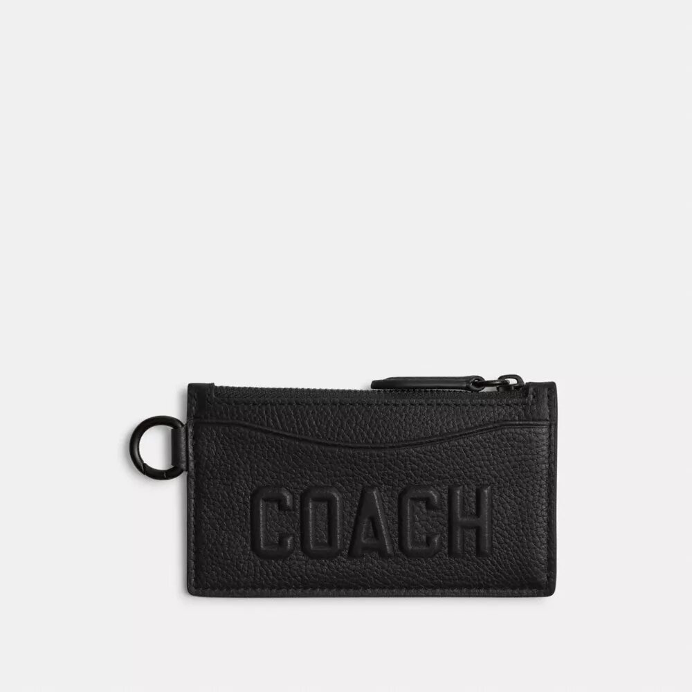 Kortfodral med dragkedja och Coach-grafik