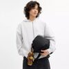 Leo Crossbody i signaturNylon med smycken