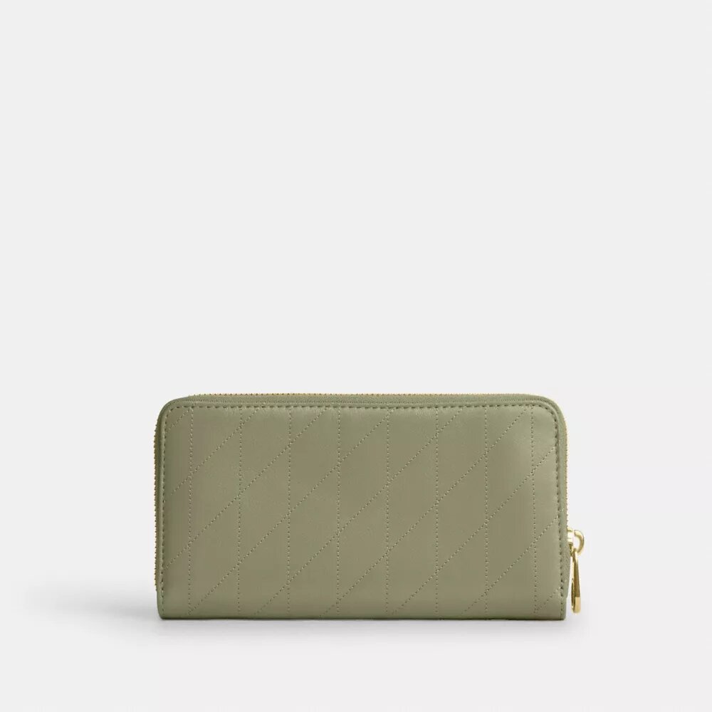Lång plånbok med dragkedja runt om och quiltad yta