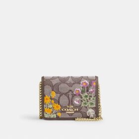 Miniplånbok med kedja i signaturjacquard med blommig brodyr