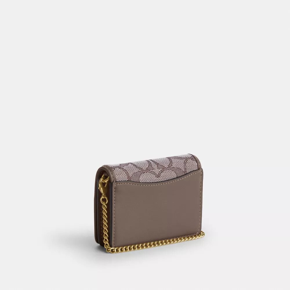 Miniplånbok med kedja i signaturjacquard med blommig brodyr