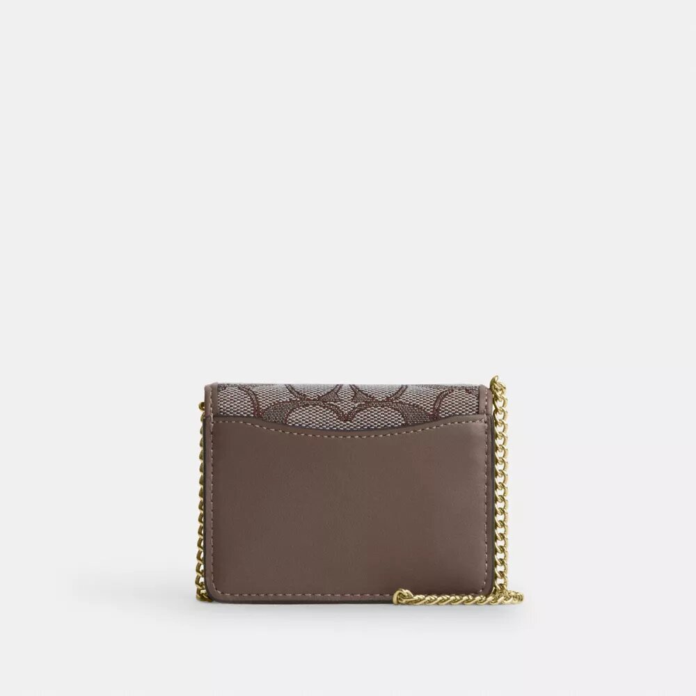 Miniplånbok med kedja i signaturjacquard med blommig brodyr