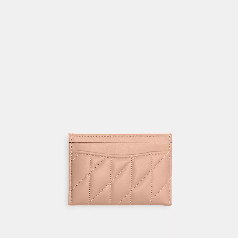 Praktiskt kortfodral med kuddliknande quiltning