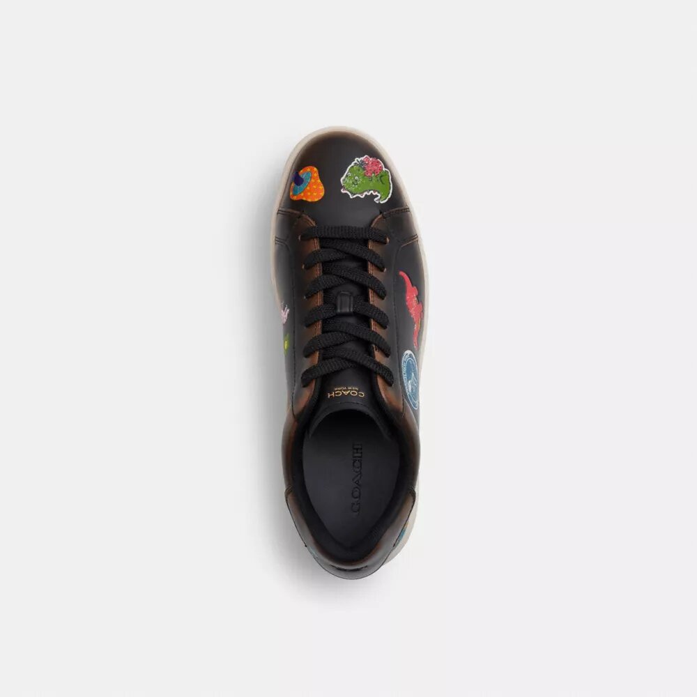 Rexy 10-årsjubileum Höga sneakers med klistermärkesmönster