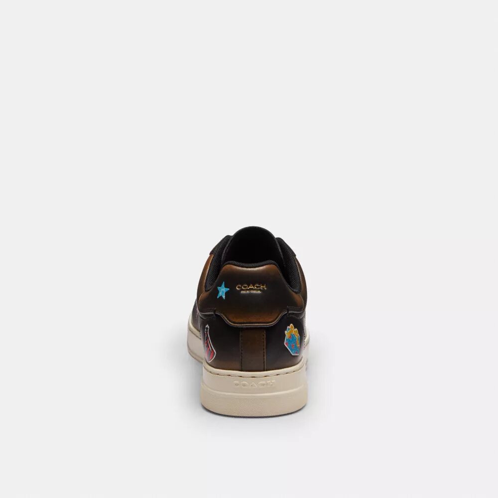 Rexy 10-årsjubileum Höga sneakers med klistermärkesmönster