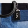 Rogue-väskor med lappverk av återanvänt denim
