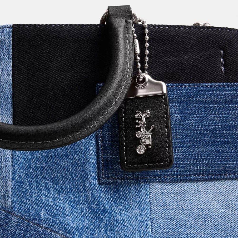 Rogue-väskor med lappverk av återanvänt denim