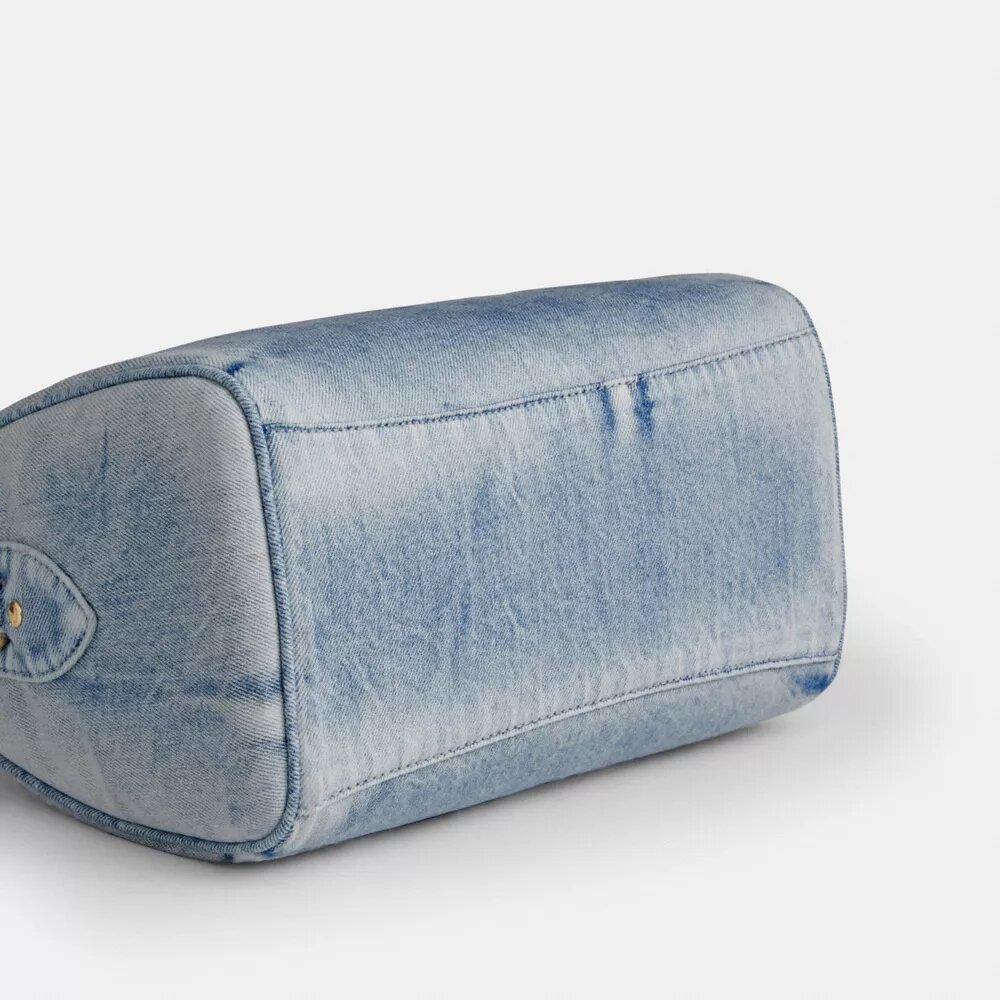 Rowan-skolväska i Loved Denim med smycken