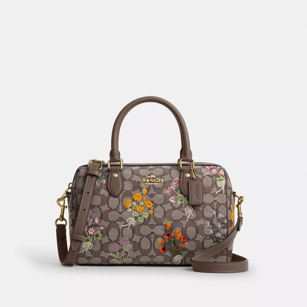 Rowan-skolväska i signaturjacquard med blommig broderi