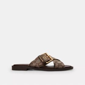 Sandaler med korsade spännen i signaturjacquard