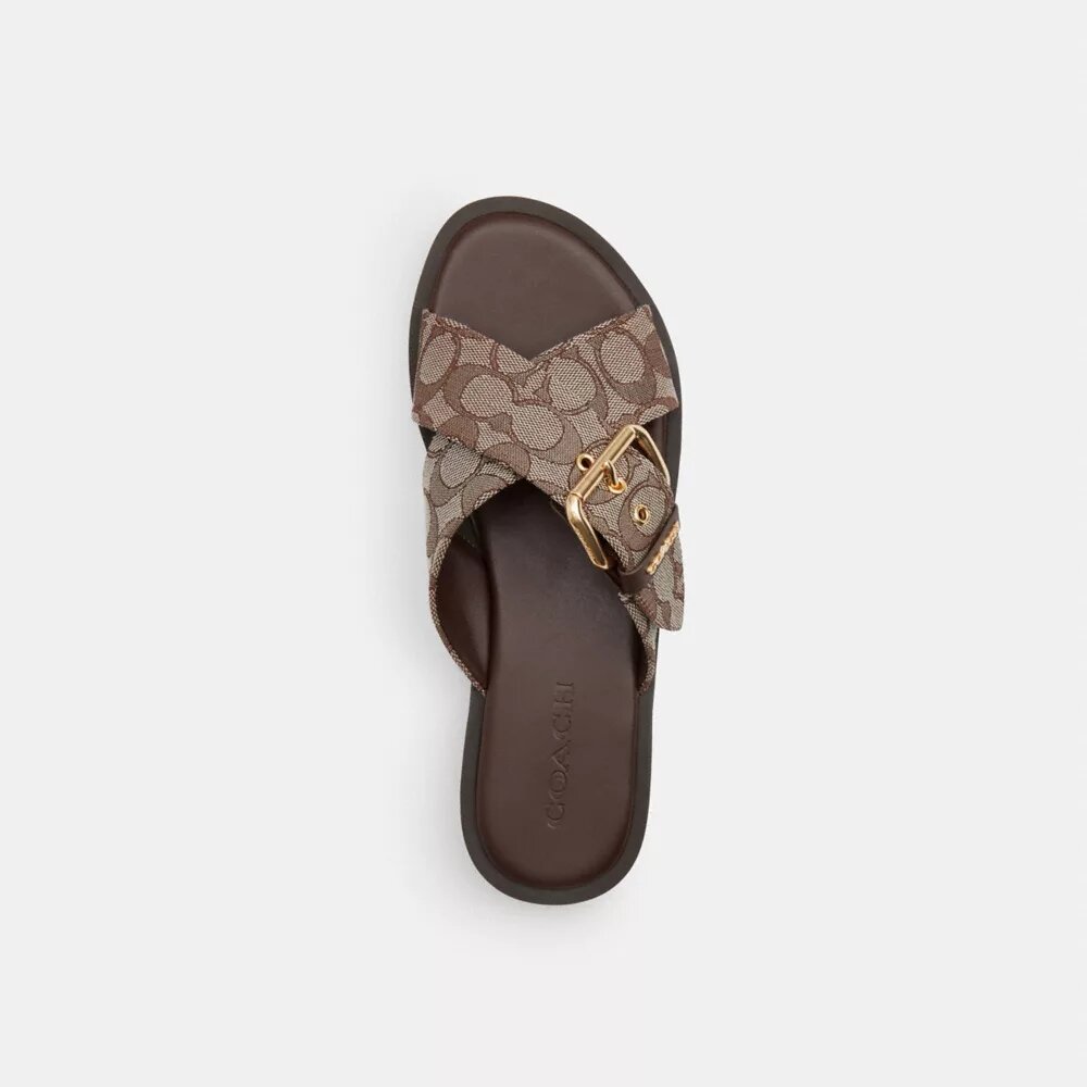 Sandaler med korsade spännen i signaturjacquard