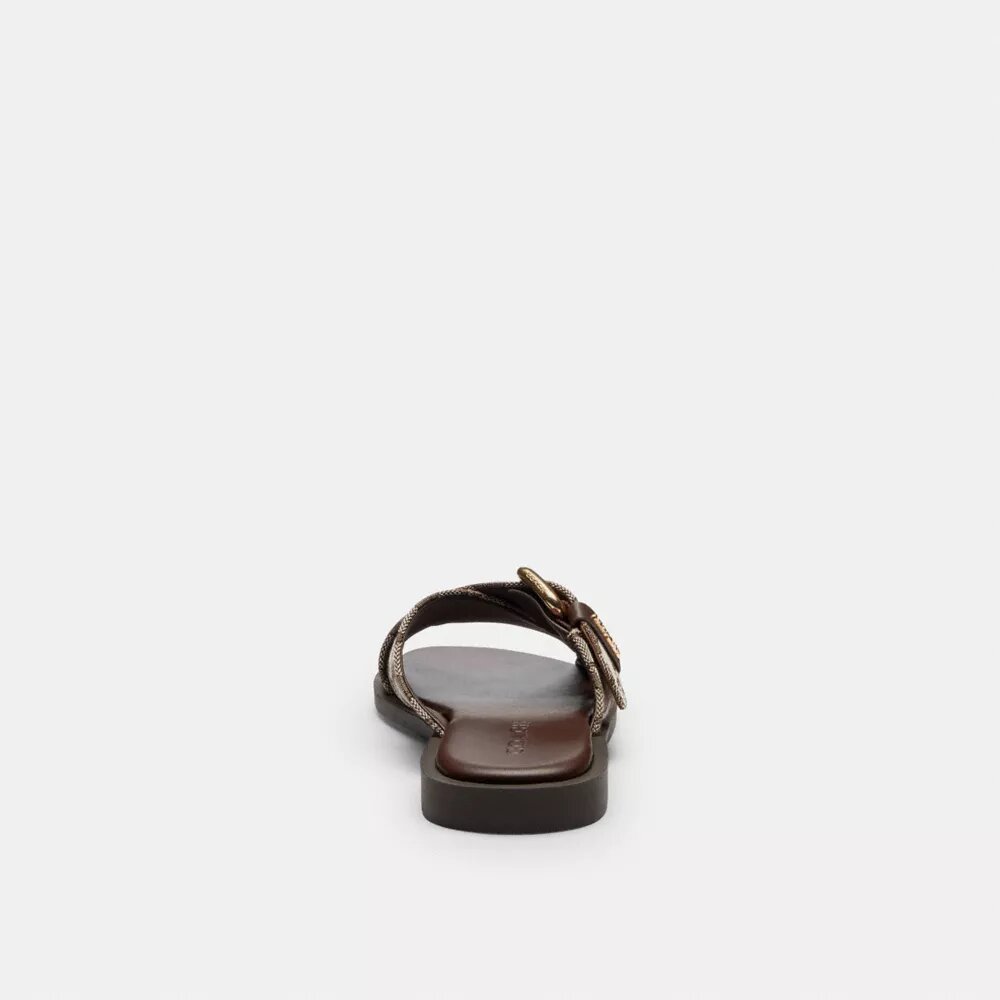 Sandaler med korsade spännen i signaturjacquard