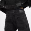 Svarta tapered-jeans i ekologisk bomull