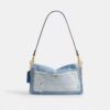 Tabby-axelremsväskor 26 med patchwork av återanvänt denim