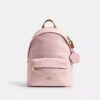 Taylor liten ryggsäck i Signature Canvas med smycken